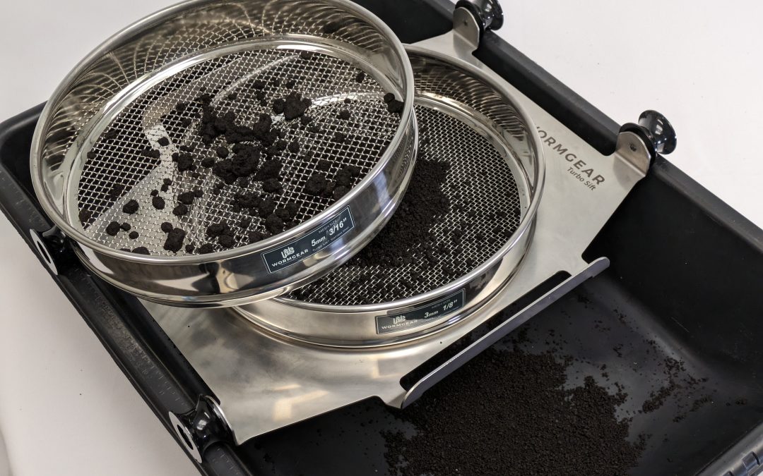 Wormgear Turbosift with dual stainless steel sieves for compost refining, showing separated compost material in a black collection tray, emphasizing its use in producing high-quality, uniform compost.